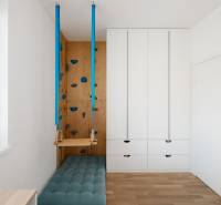 A children's room with a climbing wall and a swing in a 4-room apartment.