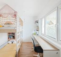 A children's room with a bed and a desk in a 4-room apartment.