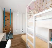 A children's room in a 4-room apartment with a bunk bed and a play wall.