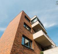 Apartment building on Cesta na Klanec, Bratislava - Lamač, with a brick facade and balconies.