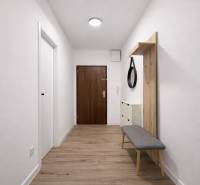 Hallway of a 2-room apartment with a wooden decor floor, mirror, and bench.
