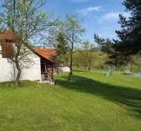 A family house in Podbranč with a spacious garden, swimming pool, and children's playground.