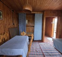 Wooden interior with a dining table, sofa, and curtains, Properties - living.