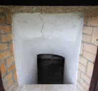 Entrance to a basement space with plastered walls and a brick frame, Land - residential.