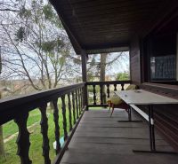 Wooden terrace with a garden view in the location of Bohdanovce for Residential Land.