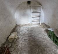Stone cellar with a shelf, box, and crates, Land - living.