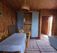 Wooden interior with a dining table, sofa, and curtains, Properties - living.