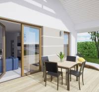 Terrace of a family house with a wooden decor floor, planters, and garden furniture.