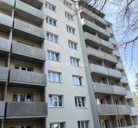 Apartment building on T. Vansovej Street in Prievidza with balconies and a gray facade.
