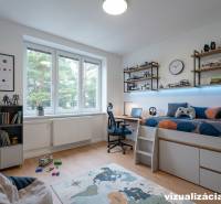 Children's room in a three-room apartment with a wooden-decor floor and shelves full of toys.