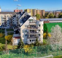 Apartment building with surrounding greenery on E. Belluša in Piešťany, suitable for a 3-room apartment.