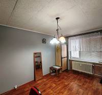 Gray walls in a 4-room apartment with wood-patterned flooring and chandeliers.