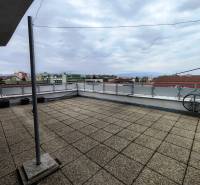Terrace of a 4-room apartment with a view of the rooftops in Sídlisko I in Vranov nad Topľou.