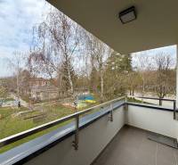 A balcony with a view of greenery in a 1-room apartment on Soblahovská in Trenčín.