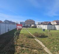 A family house on Chorvátska Street in Slovenský Grob with a large fenced yard.