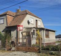 A family house on Chorvátska Street in Slovenský Grob with traditional roofing and a satellite dish.