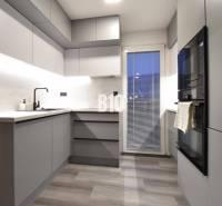Stylish kitchen with grey furniture in a 4-room apartment, floor with wood decor.