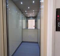The interior of the elevator with lights and a mirror shows the 4th floor in a 3-room apartment.