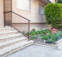 Entrance to a 3-room apartment on Nábrežná Street in Nové Zámky with a flower garden.