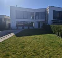 A family house in Zvončín with a spacious lawn and sunny exterior.
