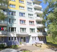 Colorful apartment building on Beskydská 9 in Banská Bystrica, surrounded by greenery.