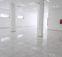 Spacious commercial spaces with white walls and glossy flooring in a decorative design.