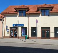 Commercial premises on Obchodná Street in Krupina with a sloped roof and display windows.