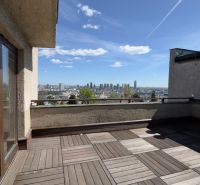Terrace of a family house in Bratislava - Staré Mesto with a wooden decor floor and a view.