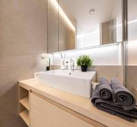 Bathroom with a modern sink, towels, and decoration in a 3-room apartment.