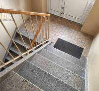 The staircase in the apartment building on Mierová Street in Sabinov with tiles.