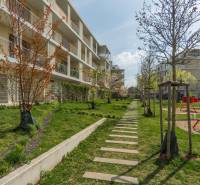 An apartment building surrounded by landscaped greenery and walkways in Bratislava - Ružinov.