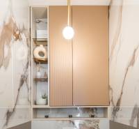 Marble cladding with decorations in the bathroom of a 3-room apartment.