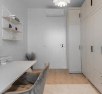 A study in a 3-room apartment with storage space, a desk, and decorative elements.