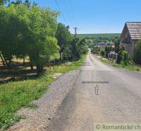A road in Hosťová surrounded by greenery, suitable for plots - housing.