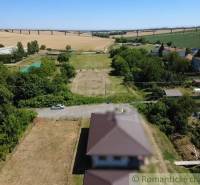 The host is showing rural residential plots with a panorama of the bridge in the background.