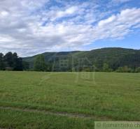 The greenery and hills in the Horný Tisovník area offer opportunities for residential plots.