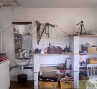 Workshop in a family house with shelves full of tools and accessories.
