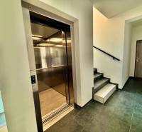 Walls with exchangers, elevator, and staircase in an apartment building on Mikovíniho Street in Trnava.