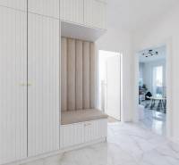 Entrance hall in a 3-room apartment with coordinated furniture and tiles with a marble pattern.