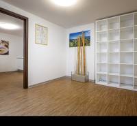 Interior of a family house with a shelving system and a wooden decor floor.