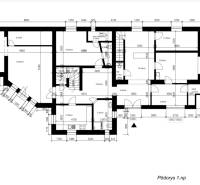 Ground floor plan of a family house with a staircase, rooms, and utility rooms.