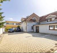 A family house on Podpriehradná Street in Bratislava-Vrakuňa with parking spaces.