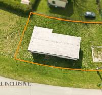 A cottage in Vojka nad Dunajom of rectangular shape, surrounded by a grassy plot.