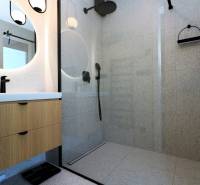 Shower enclosure with glass doors and a sink in a 4-room apartment.