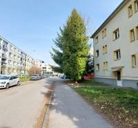 Buildings and cars on Obrancov Mieru Street in Prešov, suitable for a 2-room apartment.