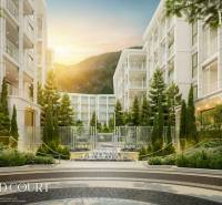 Apartment construction in Phuket with elegant architecture and landscaped greenery in the exterior.