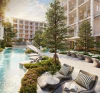 The construction of apartments in Phuket with a pool and greenery creates a relaxing environment.