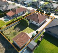 A family house in Kútniky with a garden and parking, enclosed by a fence.