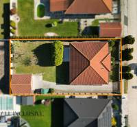 Aerial view of a family house with a red roof in Kútniky.