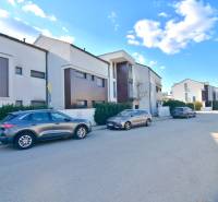 Family houses and parked cars on Uhliská Street in Bratislava-Vajnory.